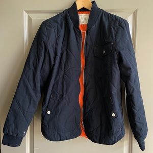 blue quilted jacket